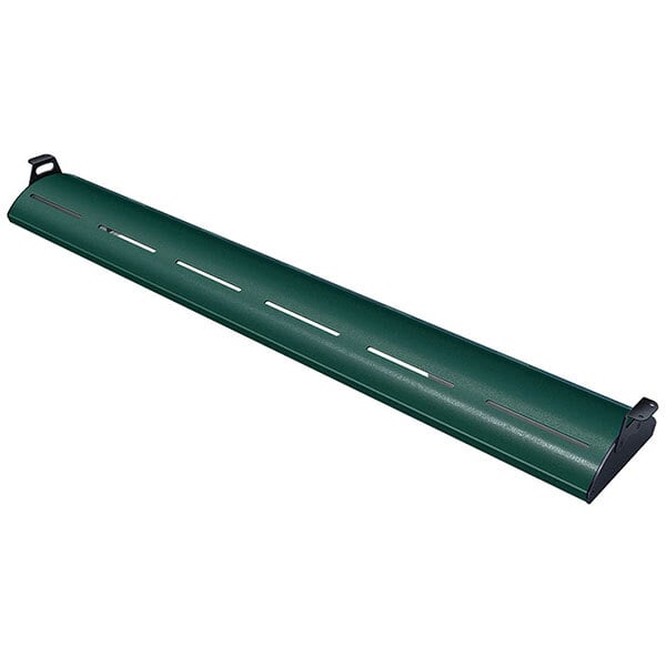 A Hatco Hunter Green curved display light with warm lighting on a green metal shelf.