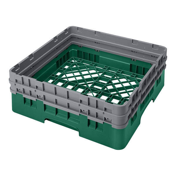 A green and gray plastic full-size base rack with closed sides and two extenders, designed for dishwashing and storage.