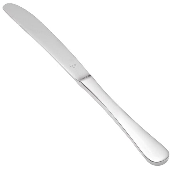 A close-up of a Libbey stainless steel dinner knife with a serrated edge and solid handle.