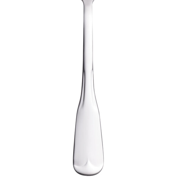 A close-up of a World Tableware stainless steel salad fork with a white background.
