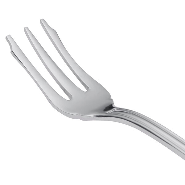 A close-up of a Libbey stainless steel cocktail fork with three prongs.