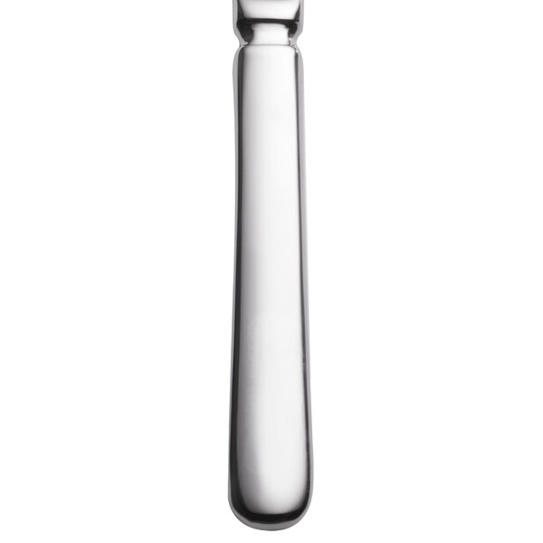 A close-up of a Libbey stainless steel steak knife with a fluted solid handle.