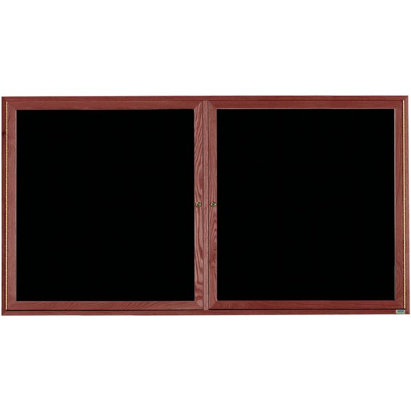 A black felt message board with wooden doors.