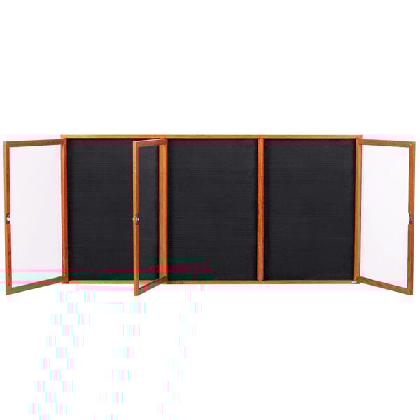 A black board with a wooden frame and three black panels.