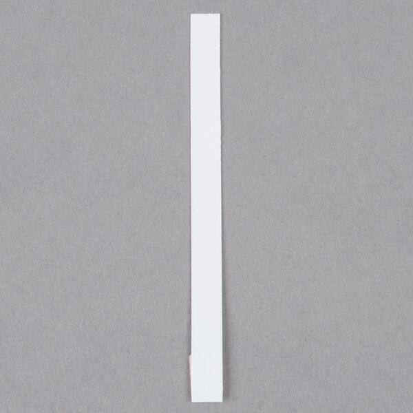 A white rectangular Purell concentration test strip.