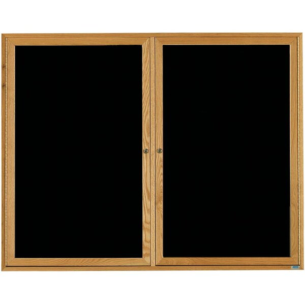 A black message board with a natural oak frame and two hinged doors.