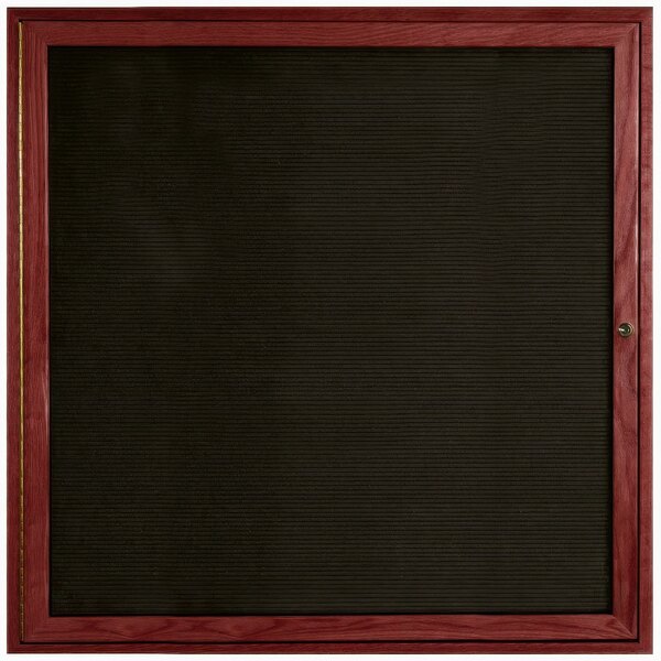 A black board with a wooden frame.