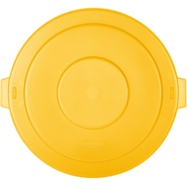 A yellow flat round lid with handles for a Carlisle Bronco trash can.