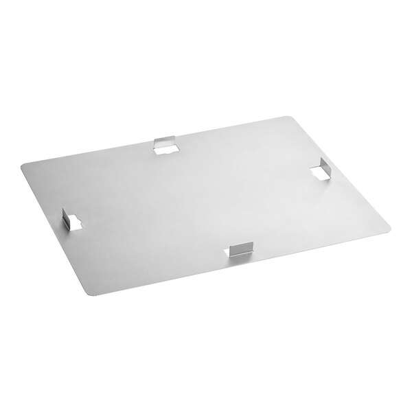 A stainless steel rectangular cover with holes on top of a table.