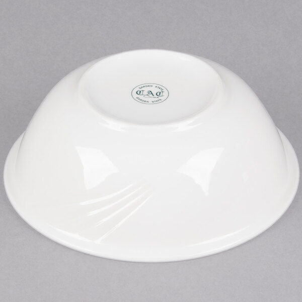 A white CAC Garden State porcelain bowl with a logo on it.