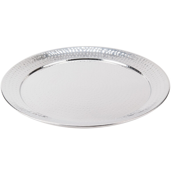 An American Metalcraft round stainless steel tray with a hammered surface.
