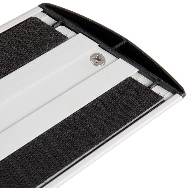 A Rubbermaid black and yellow mop frame.