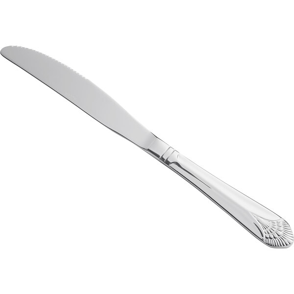 An Acopa Monaca stainless steel table knife with a white handle on a white background.