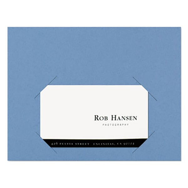 A blue Smead file jacket with a white label on blue paper.
