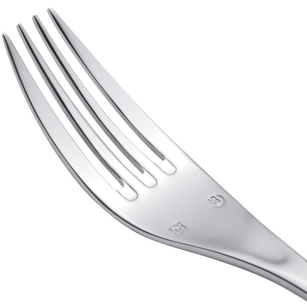 A close-up of a Chef & Sommelier stainless steel dinner fork with four tines.