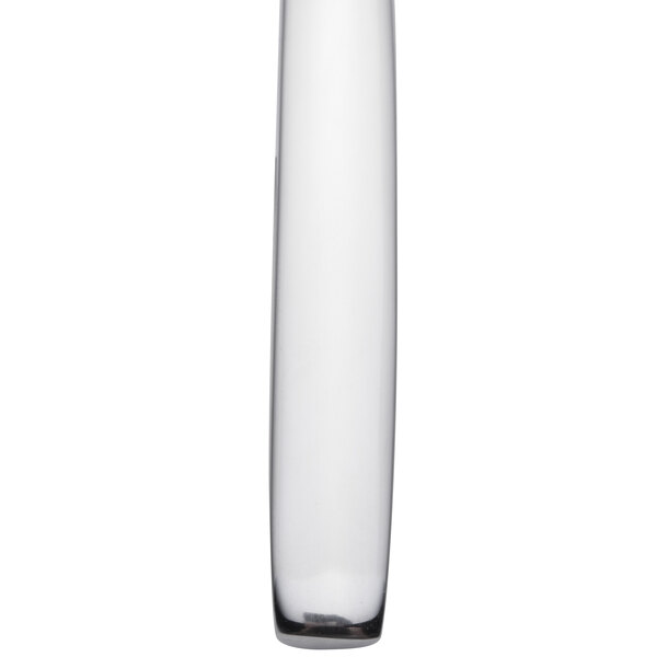 A tall clear glass vase.