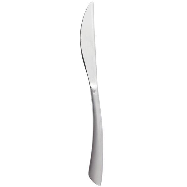 A silver knife with a white handle.