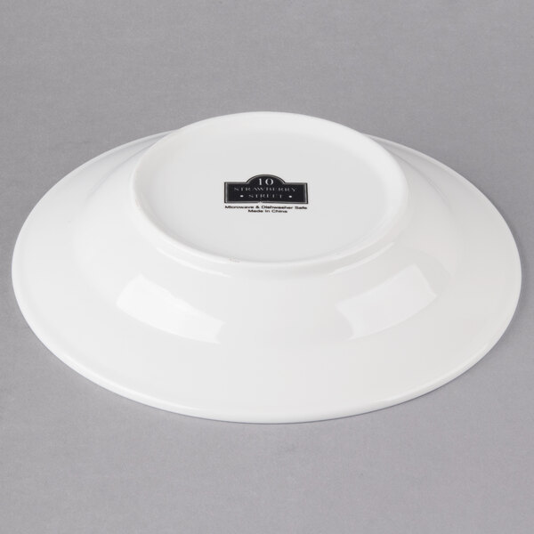 A white porcelain bowl with a black rim and label.