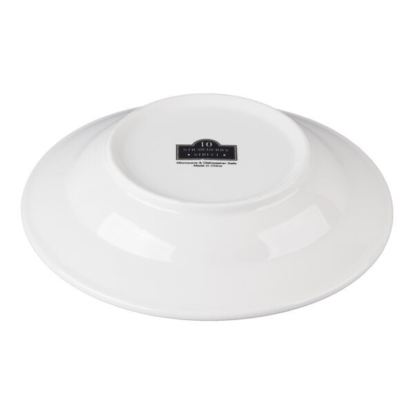 A white porcelain rim soup bowl shown upside down.