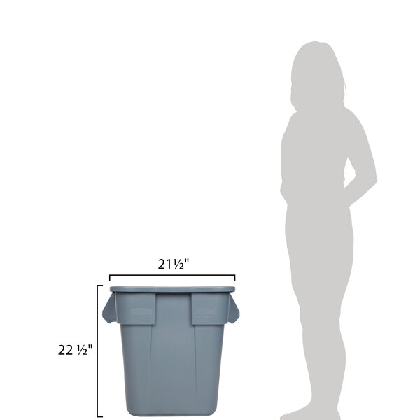 A woman standing next to a Rubbermaid grey square trash can with two handles.
