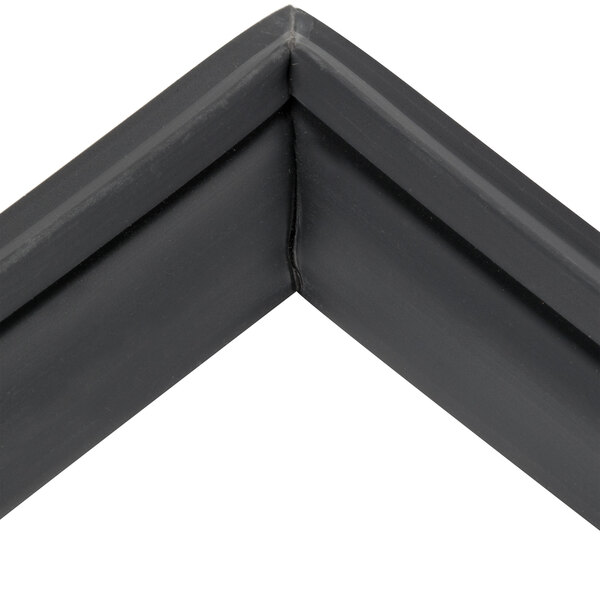 A black corner of a True 810862 refrigerator door gasket.