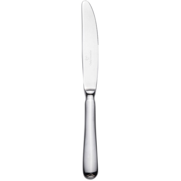 A silver dessert knife with a white handle.