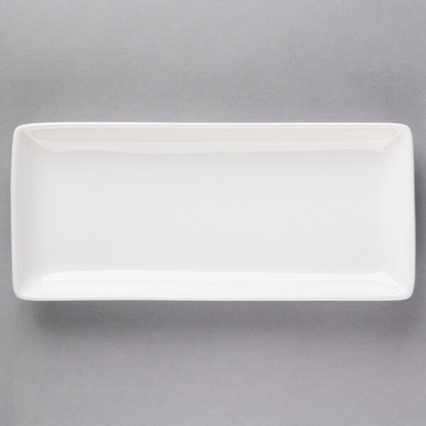 A white rectangular 10 Strawberry Street porcelain coupe platter on a gray background.