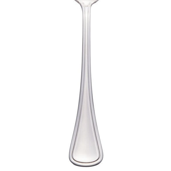 A Libbey serving spoon with a white handle and silver spoon.