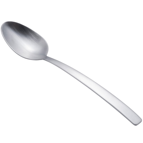 An Arcoroc stainless steel demitasse spoon with a silver handle.