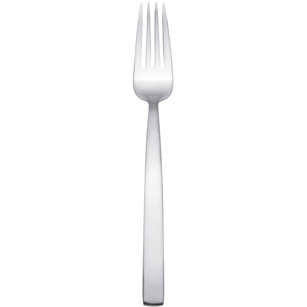 An Arcoroc stainless steel dessert fork with a silver handle.