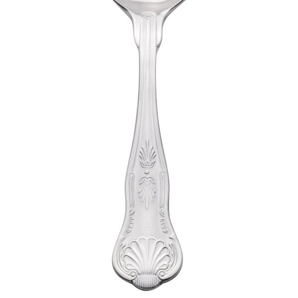 A Libbey stainless steel bouillon spoon with a design on the handle.
