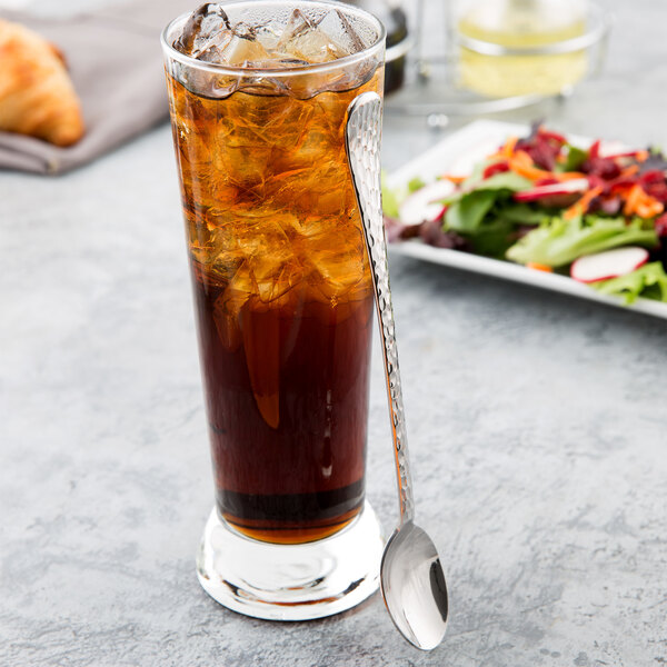 A glass of iced tea with a Libbey stainless steel iced tea spoon.