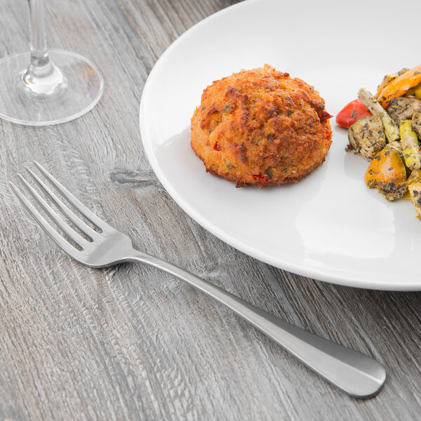 A plate of food with a Libbey stainless steel European dinner fork.