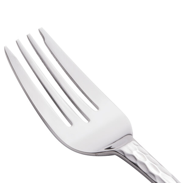 A close-up of a Libbey stainless steel salad fork with a silver handle.