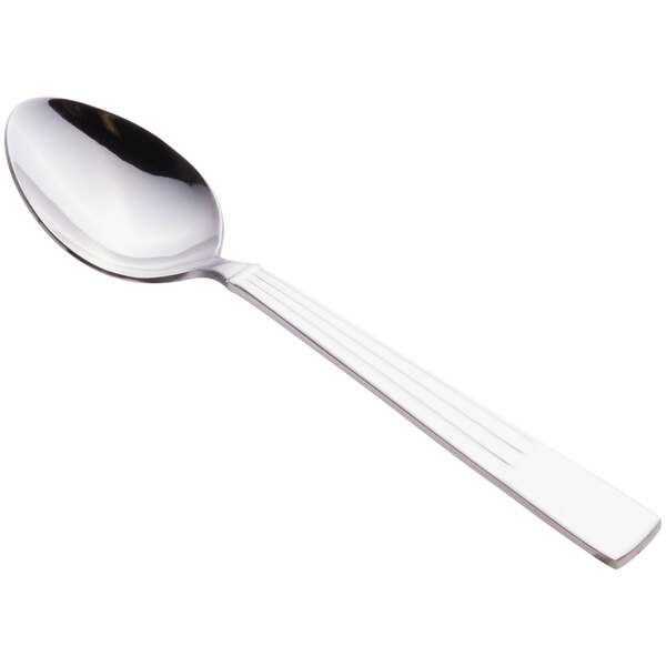 A Libbey stainless steel dessert spoon with a silver handle and bowl.