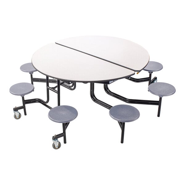 A National Public Seating round cafeteria table with stools underneath.