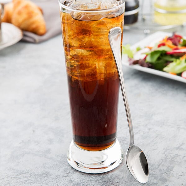 A glass of iced tea with a Libbey stainless steel iced tea spoon.