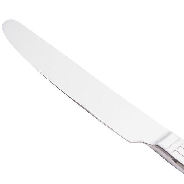 A Libbey stainless steel dinner knife with a silver handle.
