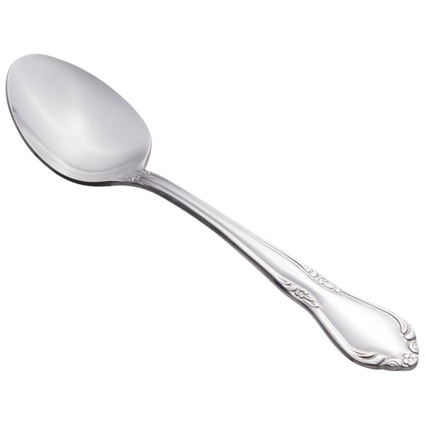 A Libbey stainless steel dessert spoon with a handle.