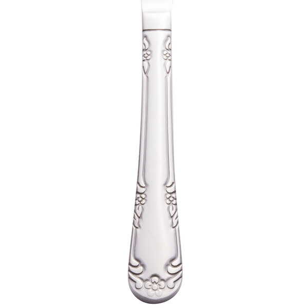 A Libbey stainless steel entree knife with a fluted design on the handle.