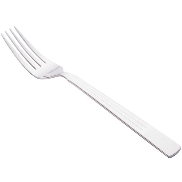 A Libbey stainless steel dinner fork with a white handle.