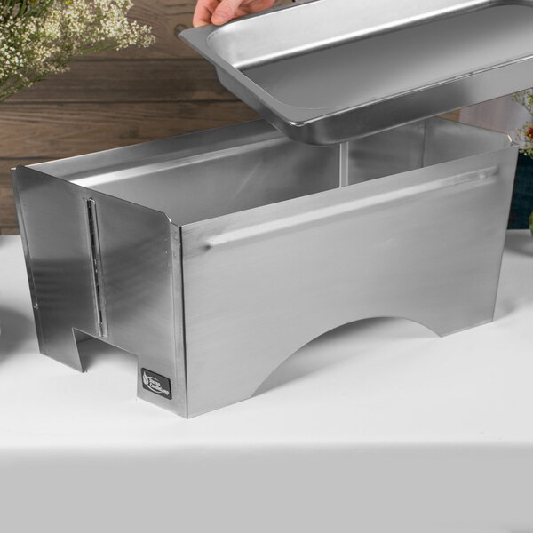A metal Sterno chafer frame with a lid open.
