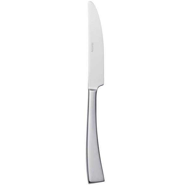 An Arcoroc stainless steel dessert knife with a silver handle.