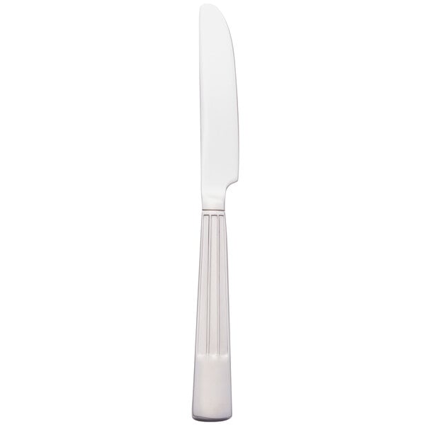 A white rectangular object with a white knife with a black handle.