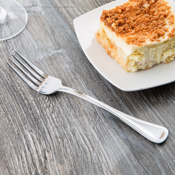 A plate of dessert with a Libbey stainless steel utility fork.