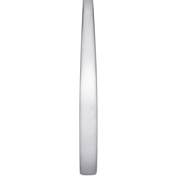 A close up of an Arcoroc stainless steel salad fork with a white background.