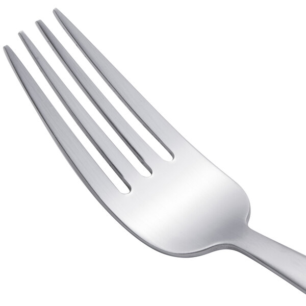 An Arcoroc stainless steel salad fork with a silver handle.