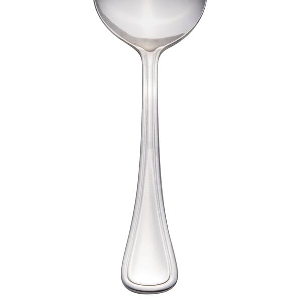 A Libbey stainless steel bouillon spoon with a handle.