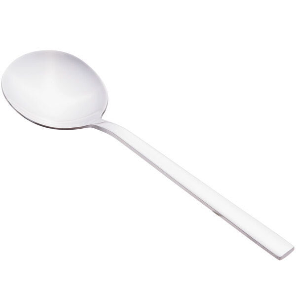 A Libbey Elexa bouillon spoon with a white handle and bowl.