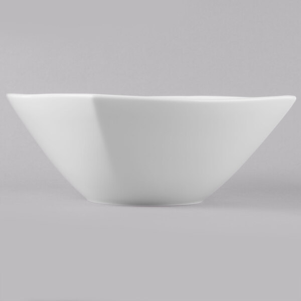 A close-up of a white Schonwald square porcelain bowl with a small rim.